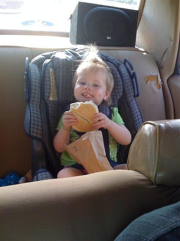 Jess_SuperBagel.jpg - Check me out eating the world's largest bagel! - Good grief, this things as big as my head Daddy!